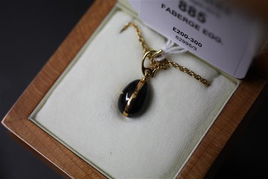 A Victor Mayer for Faberge 18ct gold, black onyx and diamond set egg pendant on 9ct gold chain,